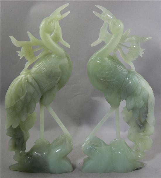 A pair of large Chinese bowenite jade figures of cranes, 20th century, 36.5cm